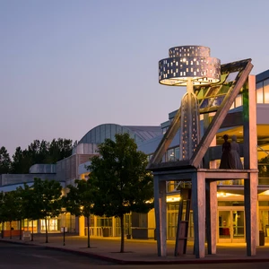 photo of the building at night with expo neon sign.