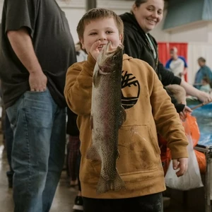 Kit with fish at trout pond at the Pacific Northwest Sportsmen Show