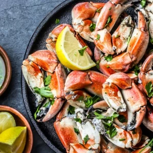 Image of crab & lemon on a plate.