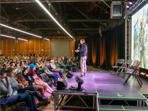 Presenter on stage at the Pacific Northwest Sportsmen Show