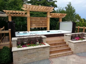 photo of hot tub with deck built around it