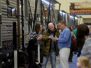 People talking to Dealer at RV Show