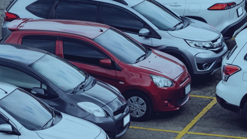 Photo of cars in parking lot. 